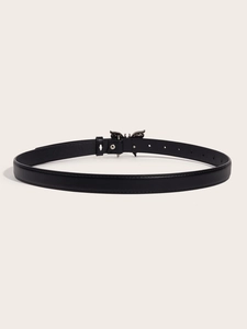 Detail view of a black leather belt featuring a decorative metal butterfly buckle closure