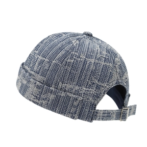 Blue and white woven Miki hat with adjustable metal strap buckle on white background
