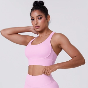 Close-up of soft pink high-elasticity fabric texture and seamless stitching on yoga set