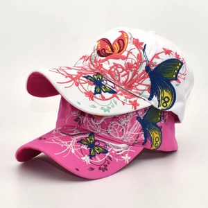 Close-up of butterfly embroidery with silver sequins on cotton baseball caps