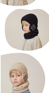 Macro detail of kids winter knit hat and neck warmer set with classic snowflake patterns