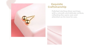 Detailed view of polished S925 sterling silver ball stud earrings in shiny golden finish
