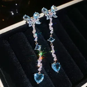 Elegant silver needle heart butterfly fringe earrings with blue zircon in a luxury jewelry box
