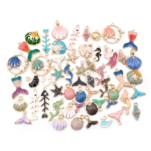Assorted colorful enamel ocean charms featuring mermaid, shells and seahorse for DIY jewelry