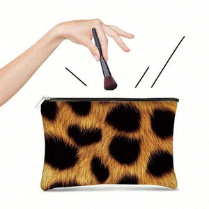 Macro detail of leopard print canvas bag showing texture and silver metal zipper closure
