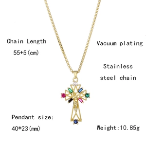 Detailed view of gold cross pendant with colorful zircon stones and size specifications
