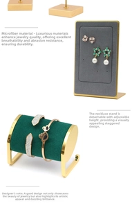 Detail view of gold metal jewelry stands with green microfiber and adjustable design