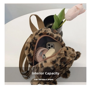 Detail view of the interior capacity of the leopard print plush mini backpack for children