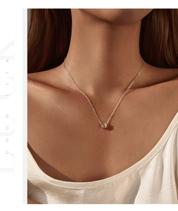 Close-up of S925 sterling silver necklace with yellow rose-cut sparkling diamond pendant