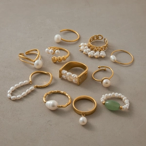 10-piece gold plated stainless steel ring set with white freshwater pearls and green stone
