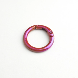 Detail of colorful UV plated spring ring alloy connector with purple gradient finish