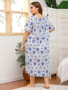 Back view of plus size floral maxi nightdress with short sleeves in light blue
