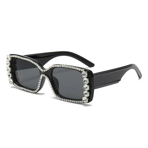 Chic oversized square sunglasses with crystal rhinestones on a dark frame and grey lens