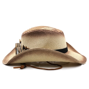 Detail of gradient woven cowboy hat with steampunk goggles and adjustable wind cord