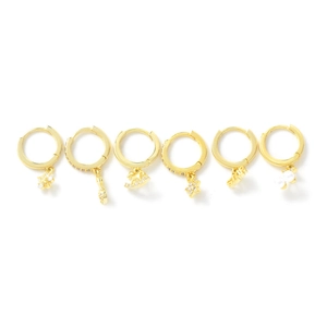 Set of six gold huggie hoop earrings with zircon floral and horse charms on white base