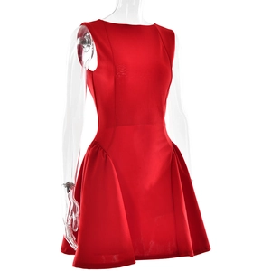 Detail view of the red sleeveless mini dress featuring ruched fabric and slim-fit A-line cut
