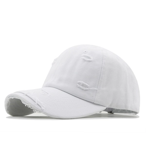 Vintage white distressed baseball cap with ripped details and a soft top for street style