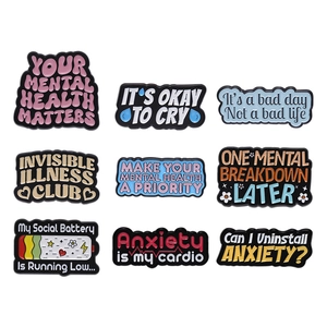 Set of 9 mental health enamel pins with colorful motivational quotes on white background
