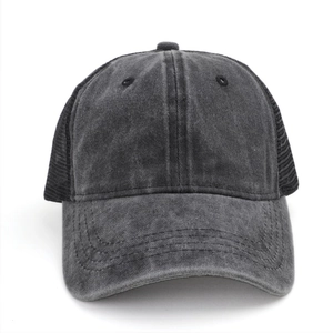 Detail of washed cotton panel and breathable black mesh back on retro baseball cap