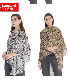 Detail of leopard print silk scarf with lightweight fabric and stylish animal pattern