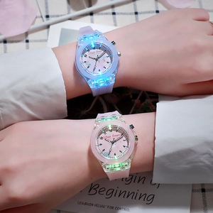 Luminous LED children's watches in blue and pink with transparent straps worn on wrist