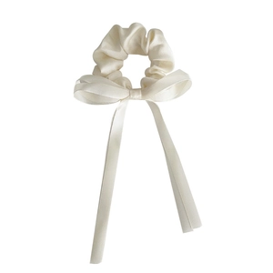 Elegant cream white satin bow hair scrunchie with long ribbon tails for women