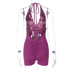 Detail view of purple halter backless romper showing pleated back and tie-up design features