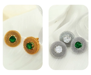 Detailed macro view of vintage oval metal mesh earrings with inlaid colorful gemstones