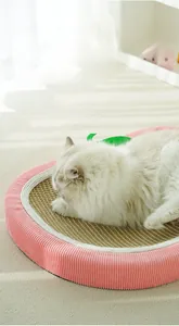 Detailed top view of a strawberry shaped sisal cat scratcher with pink striped velvet edges