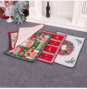 Close-up of Christmas rubber doormat with non-slip backing and Feliz Navidad print