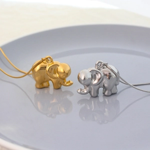 Minimalist elephant pendant necklaces in gold and silver finish with sleek snake chains