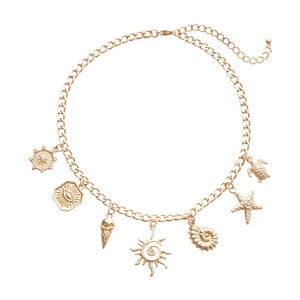 Gold metal charm necklace featuring sea shell starfish and sun pendants in a layered design