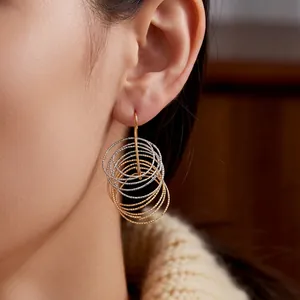 Minimalist two-tone multi-layered circular dangle earrings with textured metal finish