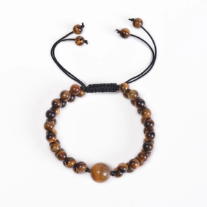 Detailed macro of 6mm natural tiger eye stone beads on a black woven braided bracelet