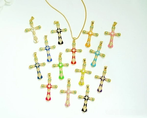 Flat lay of 14 colorful enamel cross pendants and a gold-plated necklace chain set