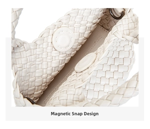 Detail of magnetic snap closure and woven leather texture on a beige mini bucket bag