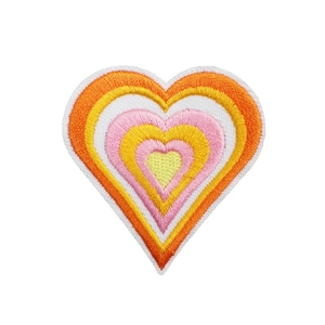 Vibrant heart embroidered patch in orange and yellow gradient for apparel and bag decor