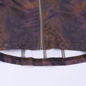 Close-up of vintage printed fabric featuring a durable metal zipper and hem stitching
