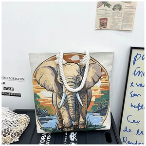 Macro shot of an elephant-themed tapestry on an off-white canvas tote bag