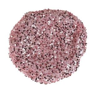 Detail of pink velvet beret featuring shimmering sequins and elastic edge texture