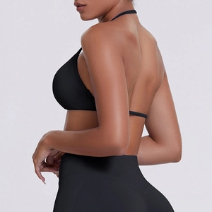 Detail of cross-strap back and high-waist fit on black seamless yoga set for fitness
