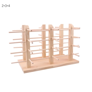 Macro detail of natural solid wood tiered display rack for eyewear and accessories