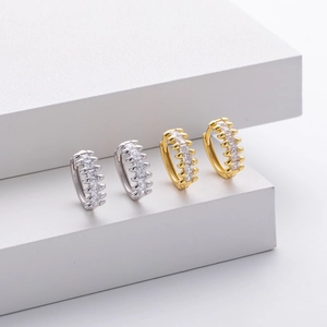Detailed view of silver and gold S925 sterling silver hoop earrings with zircon stones