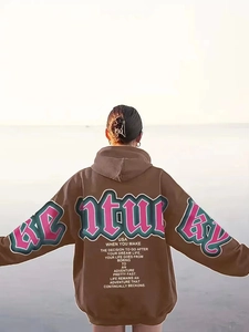 Macro detail of the oversized brown hoodie with Kentucky USA printed graphics