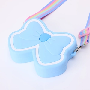 Close-up of light blue silicone butterfly crossbody bag with rainbow adjustable strap