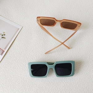 Retro square kids sunglasses in amber orange and matte green for stylish UV protection