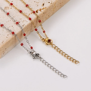 Detail of red beaded stainless steel chains with adjustable lobster clasp and extender