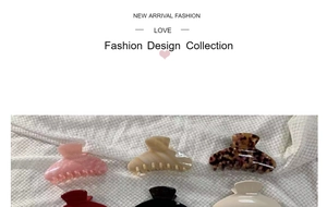 Detail showing various colors of large glossy hair claws on white textured fabric