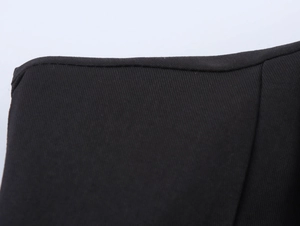 Detail shot of black twill fabric stitching and edge seam on sexy commuter vest set