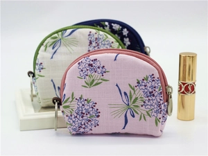 Floral semicircular coin purses with metal zippers and key rings in assorted colors